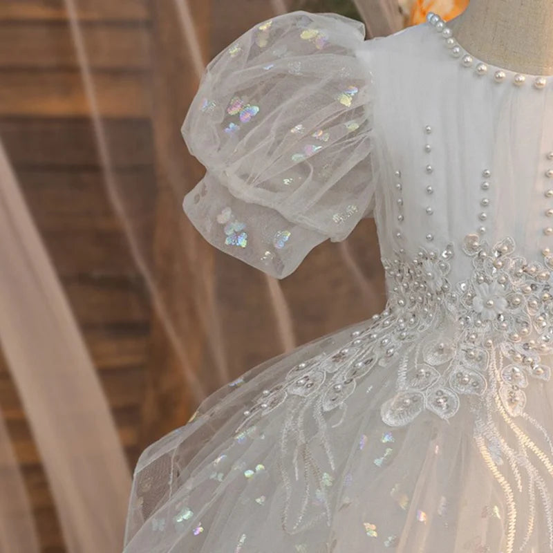 White girls party dress puff sleeve and embroidered bodice detail, close-up
