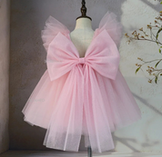 Pink tulle party dress back view with oversized bow