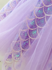 Layered sequin and tulle panel detail on purple dress