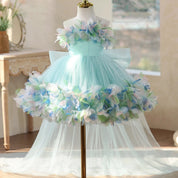 Lake blue dress back view with oversized bow and train