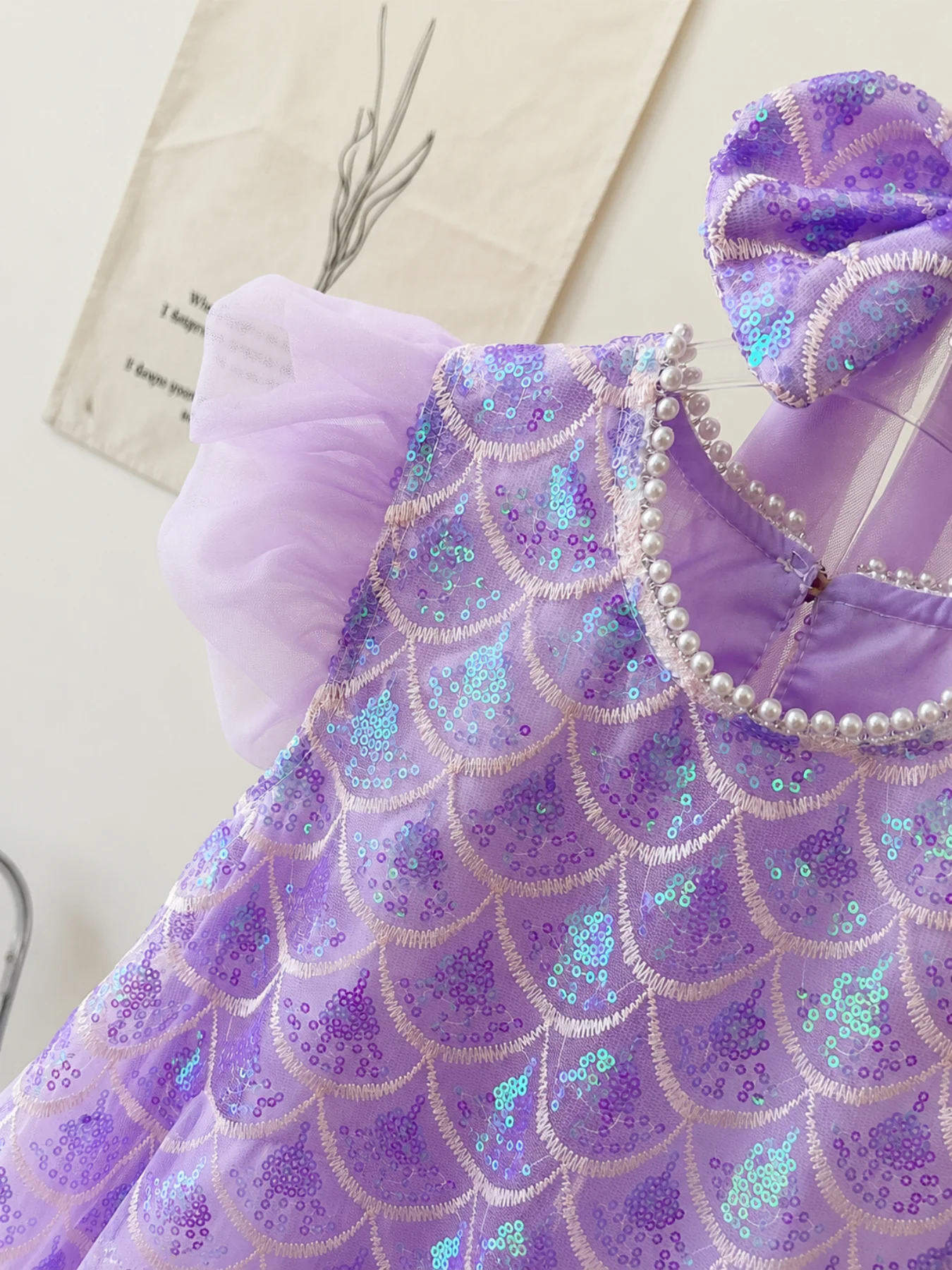 Purple sequin tulle dress full front view on dress form