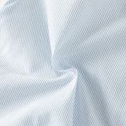 Close-up of pale blue pinstriped dress fabric
