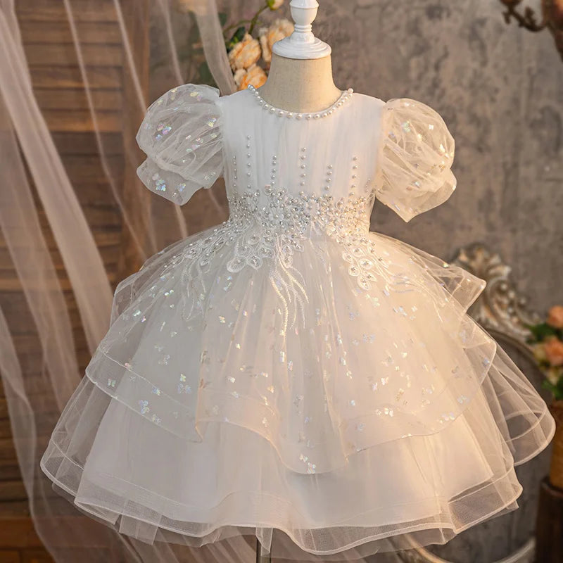 White girls party dress with puff sleeves, embroidered bodice and layered skirt, front view