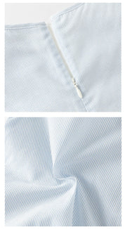 Close-up views of back zipper and blue pinstriped fabric
