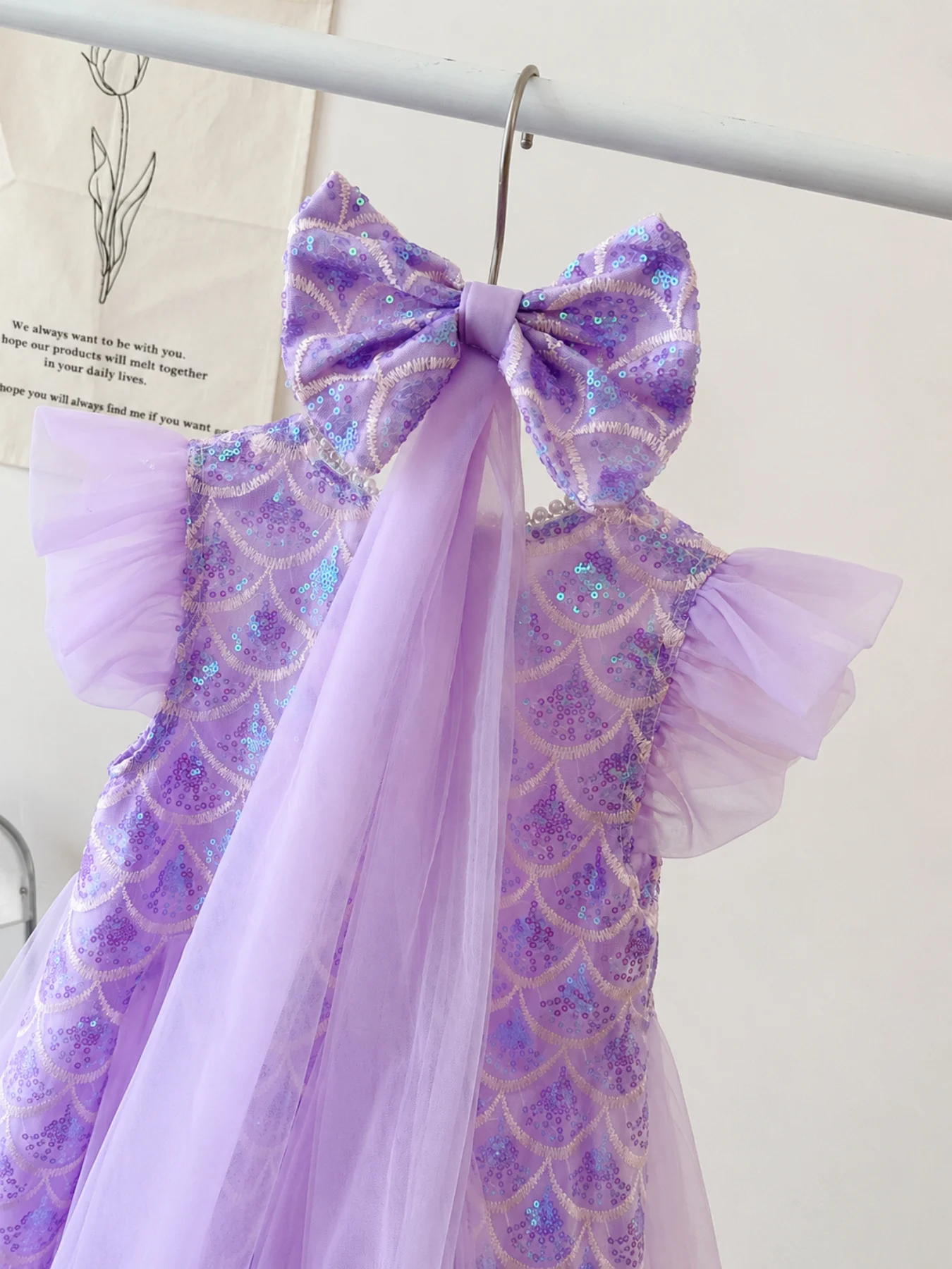 Iridescent scallop sequin bodice detail on purple dress