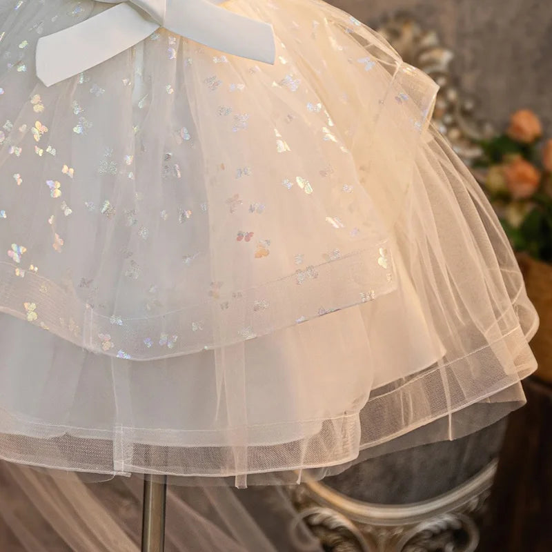 White girls party dress layered skirt and back bow detail, close-up