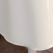 Full white skirt hem detail on flower girl dress