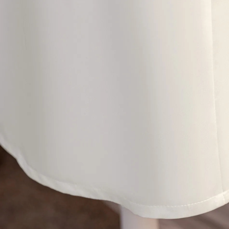 Full white skirt hem detail on flower girl dress