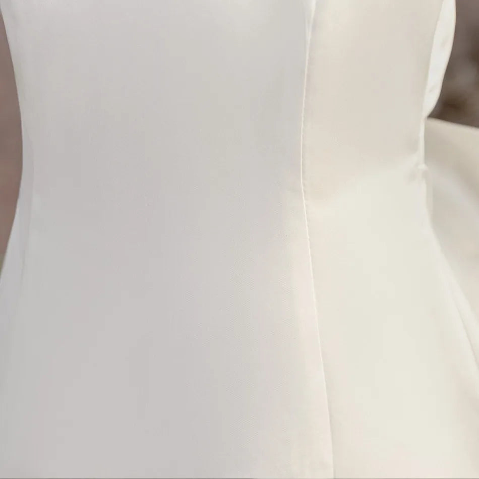Fitted bodice seam detail on white flower girl dress