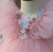 Pink floral and pearl-look bodice close-up