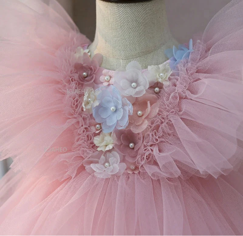 Pink floral and pearl-look bodice close-up